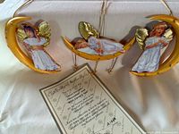 All three Magical Moonbeams ornaments with certificate visible