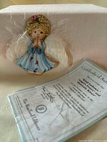 Angel ornament front view with certificate