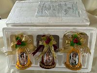 Three Bradford Exchange porcelain bell ornaments in original Styrofoam box with certificate