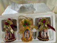 Three Bradford porcelain bell ornaments in original Styrofoam packaging