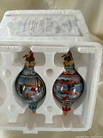 Both Bradford Exchange Winter Cardinal ornaments in original styrofoam holder