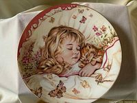 Front view of plate showing full artwork and gold rim