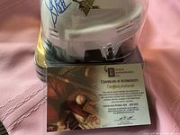Helmet front and certificate showing Sidney Crosby autograph and authentication details