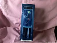Front of sealed box showing lamp image