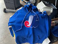Front view of blue hoodie with Expos logo