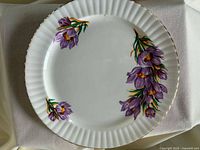 Front view of Royal Windsor plate showing floral design and gold rim