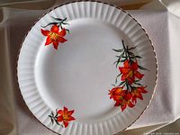 Front view of Royal Windsor Prairie Lily plate showing floral design and rim