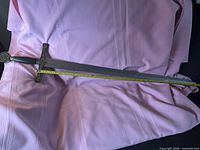 Full view of replica sword with measuring tape showing 36 in. blade length