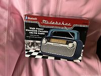 Front of sealed retail box showing Studebaker SB2003BT radio