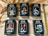 Front view showing six sealed Star Wars Bust-Ups boxes with character artwork