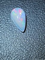 Pear-shaped opal front view highlighting colour play
