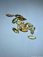 Group of 10 marquise tanzanite gemstones showing color range