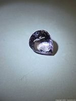 Front view of pear cut amethyst showing color and shape