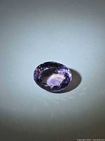 Top view of oval faceted ametrine gemstone