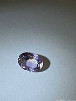 Front view of oval faceted gemstone