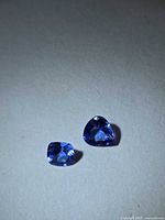 Pair of Tanzanite gemstones side by side