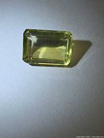 Front view of rectangular lemon citrine showing color and cut