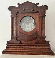 front view showing overall design, circular opening and carved details