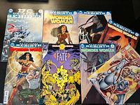 All eight comics laid out showing full covers