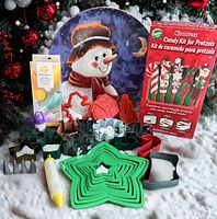 All items: snowman plate, pretzel candy kit box, Wilton bags pack, piping tools, cookie cutters displayed