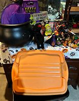 Overall lot showing cauldron, figures, signs, lights and tote lid