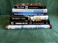 All six books stacked, spines visible