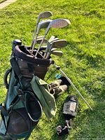 Full view stand bag with clubs, towel, shoes, headcover