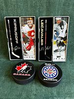 Overall view of two mini sticks in cases and two pucks