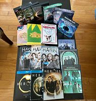 Top view showing Merlin, Quantum Leap, Muppet Show, Gremlins, Haven, Heroes, Matrix cases