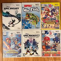 All six Wii game cases laid out showing front cover art