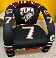 Front view of Guelph Storm jersey armchair showing logo, number 7, Parent name