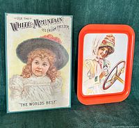 Front view showing both metal advertising pieces