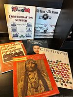 All six vintage publications laid out for full view of covers