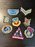 All eight patches laid out on dark surface