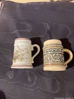 Both miniature steins side by side top view