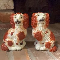 Both spaniel figurines side by side showing overall appearance