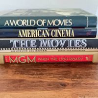Stacked view of the four hardcover movie books showing spines with titles