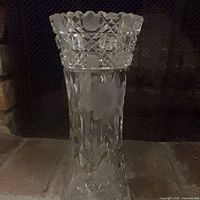 Full view of vase showing cut patterns and scalloped rim