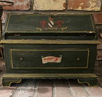 Front view closed showing folk art front panel and drawer