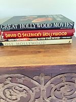 Stack of four movie-themed coffee table books