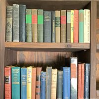 Full shelf of assorted vintage hardcover books
