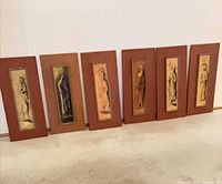 All six mounted paintings lined up showing fronts