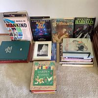 Overview of all books arranged upright and stacked