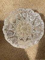 top view of cut crystal bowl showing scalloped rim and thumbprint pattern