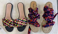 Pair of J.Crew braided multicolour slides beside DVF x Castañer wrap-tie espadrilles