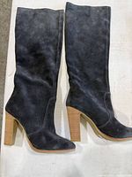 Both pairs tall dark grey suede boots, block heels, displayed side by side