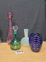 Group shot of all four art glass pieces on table