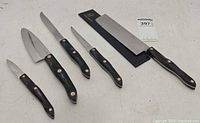 Group of five Cutco knives with blade guard