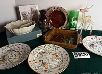 Group shot of all items including Lenox bowl on box, Hull ashtray, deer figurine, plates, vase, glass, rectangular ashtray, and tile