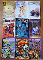 All nine comic books laid out front covers visible